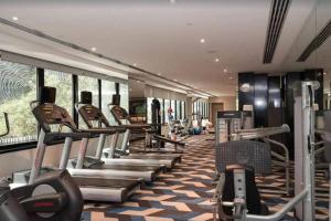 a gym with a row of treadmills and machines at Hidden GEM at Newstead in Brisbane
