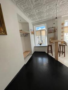 an empty room with a table and a window at Andreevskiy mini-hotel in Kyiv