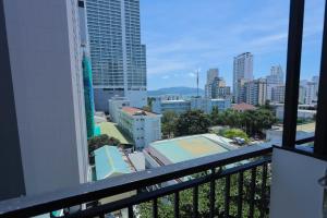 a balcony with a view of a city at Golden Rain 2 Hotel in Nha Trang