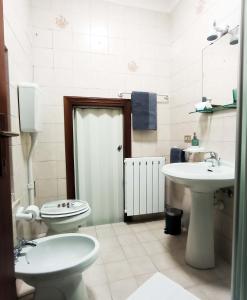 Koupelna v ubytování MiloHome - Verona + 12 fotografií