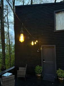 a group of lights hanging from a house at Tiny House & Loft House in Panguipulli