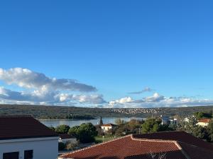 a view of a lake from the roofs of houses at Apartment Vitezic in Punat