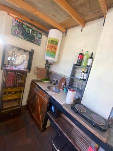 a kitchen with a counter with a sink and a counter at ProyectoQva Glamping in Villa Ballester