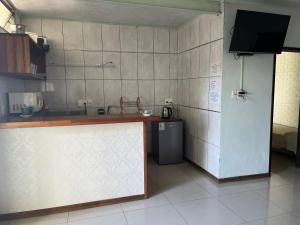 a kitchen with a counter top and a refrigerator at Relax IV in Paysandú