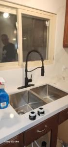 a kitchen counter with a sink and a sink at Bearfoot Bungalow in Sauble Beach