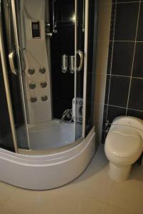 a bathroom with a shower and a toilet at Maris , Greek House @ City Center ALSANCAK in Konak