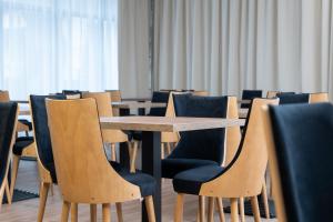 a conference room with tables and chairs at Rzemieślnik Zakopane in Zakopane