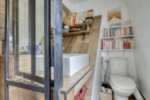 a bathroom with a toilet and a sink at Charming Designed Loft - Latin Quarter - Paris 05 in Paris