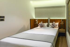 Postel nebo postele na pokoji v ubytování Hotel Eden Serenity