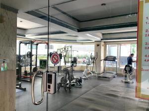 a fitness room with a gym with machines at Chomdoi Apartment,Mountain View,near nimman,pool,Wifi in Chiang Mai