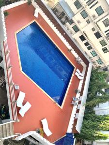 an overhead view of a building with a swimming pool at Chomdoi Apartment,Mountain View,near nimman,pool,Wifi in Chiang Mai
