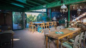 a dining room with wooden tables and chairs at Penzión ROYAL in Bytča