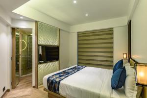 Postel nebo postele na pokoji v ubytování Hotel Eden Serenity