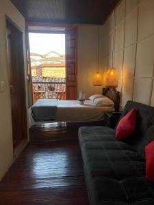 Postel nebo postele na pokoji v ubytování Hotel Colonial Abejorral