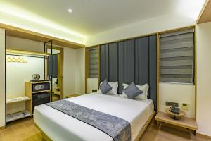 Postel nebo postele na pokoji v ubytování Hotel Eden Serenity
