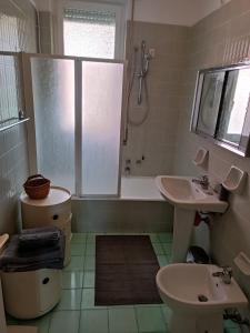 a bathroom with a toilet and a sink and a shower at Casa Monteprato in Zoagli