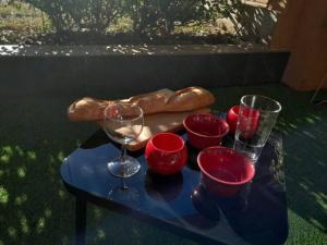 a table with wine glasses and a bagel on it at Appartement spacieux &très calme. Spacious & very quiet apartment. in Carros