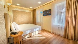 Lova arba lovos apgyvendinimo įstaigoje Hotel Bankir Khiva