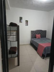 Postel nebo postele na pokoji v ubytování Hotel Policarpa