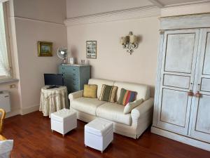a living room with a couch and a table at loft flavia in Viareggio