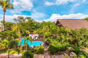 an aerial view of a resort with a swimming pool at The Hotel by the Red Canal in Mandalay