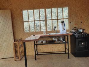a kitchen with a counter and a sink and a stove at Ese Lugar Retirado in Miraflores +17 photos