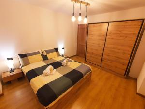 Postel nebo postele na pokoji v ubytování ElvesHome - Alpine Stay Apartments