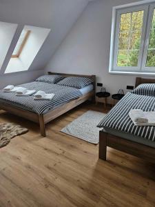 Een bed of bedden in een kamer bij Horský apartmán MIKI