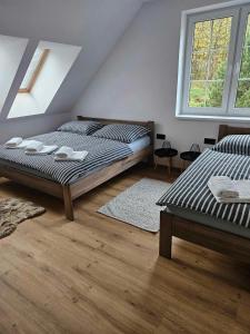 Postel nebo postele na pokoji v ubytování Horský apartmán MIKI + 28 fotografií