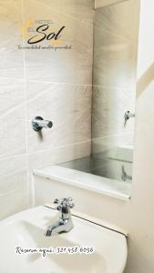 a bathroom with a sink and a mirror at Hotel El Sol Inn in Aguachica +74 photos