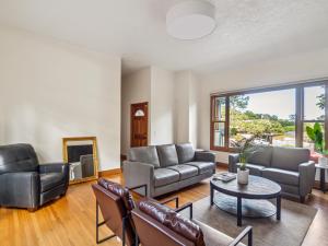 a living room with a couch and a table at Coastal Serene Retreat in the Heart of Monterey! home in Monterey