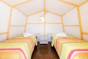Postel nebo postele na pokoji v ubytování Paradise Beach Camping
