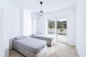 Ένα ή περισσότερα κρεβάτια σε δωμάτιο στο Nikkon summer house