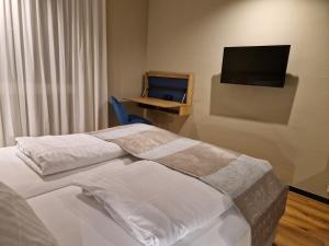 Postel nebo postele na pokoji v ubytování Hotel Wehra