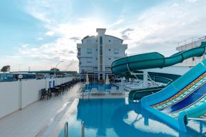 a pool on a cruise ship with a water slide at Sarp Hotel Kadriye in Belek