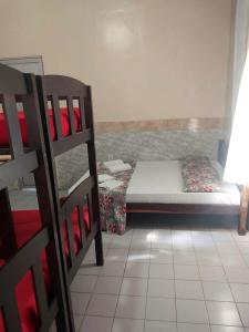 Postelja oz. postelje v sobi nastanitve Pousada e Hostel Lua de Tomate