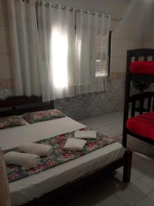 Postelja oz. postelje v sobi nastanitve Pousada e Hostel Lua de Tomate