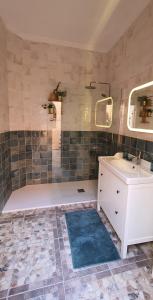 a bathroom with a sink and a shower at Puerto Mogan Casa Feliz in Puerto de Mogán