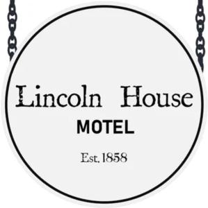 a sign for a lincoln house motel with a chain at Lincoln House Motel in Lincoln