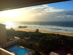 a view of the beach from the balcony of a condo at Stella Maris 118 in Amanzimtoti