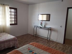 Voodi või voodid majutusasutuse POUSADA DA PONTE IBIRAQUERA toas