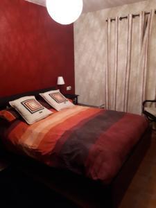 a bedroom with a bed with two pillows on it at Saldes Pedraforca in Saldés