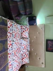 a group ofpillows on a wall in a bedroom at Eunique Residence in Port Harcourt