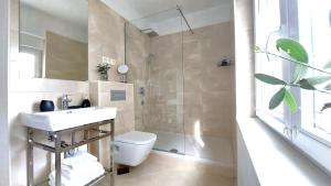 Koupelna v ubytování Refresh Boutique Apartments