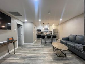 a living room with a couch and a table at Apt 4 - High Plains Lodge at Nomad Landing in Clayton