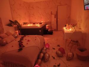 a bedroom with a bed and balloons on the floor at Spa NESSA in Saint-Andiol +6 photos