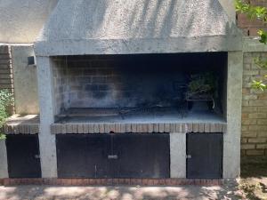 a brick oven with a fire inside of it at Viajar y sentirse en casa! in Mendoza