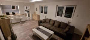Χώρος καθιστικού στο 3 Zimmer Ferienwohnung in Jever
