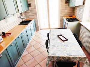 a kitchen with a table with a tray on it at Appartamento vacanze da Paola in Roccabruna
