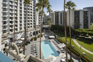 an aerial view of a hotel with a pool and palm trees at Costa Mesa Marriott in Costa Mesa
